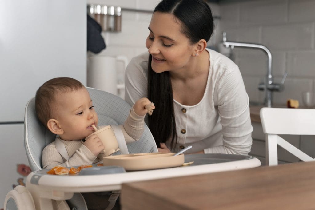 baby eat food from his mom